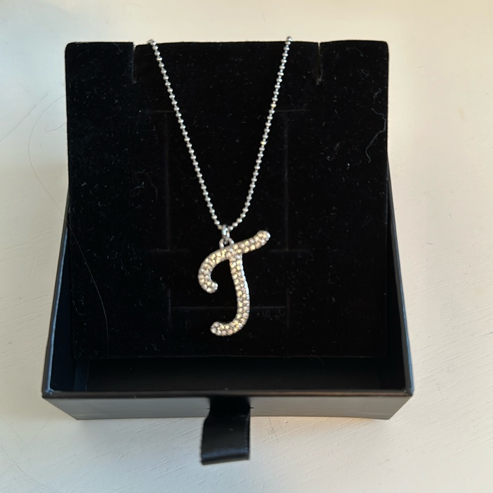 Silver necklace. Initial J